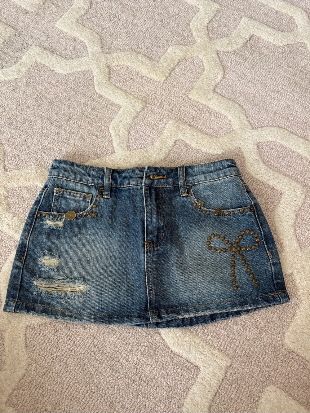 Edikted Blue Denim Mini Skirt with Stud Bow Detail